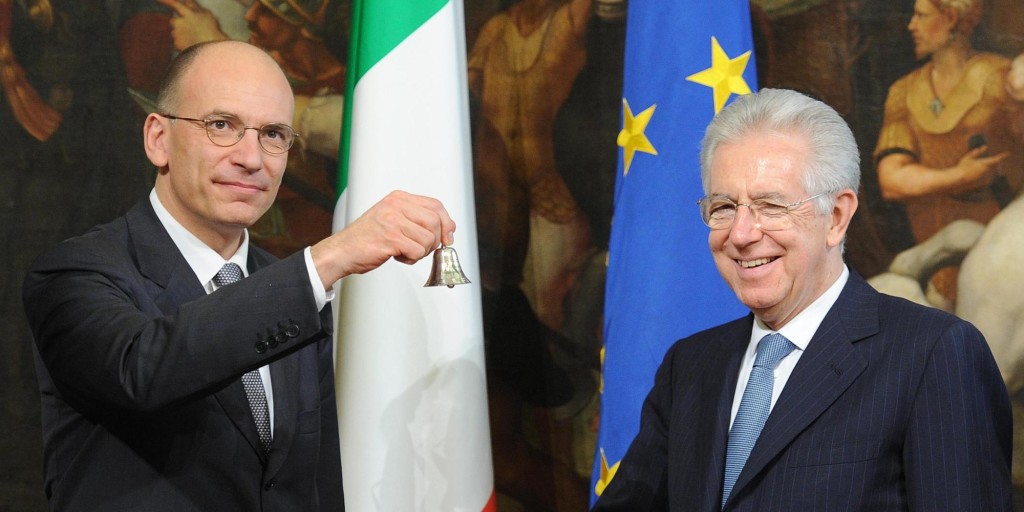 Italy's new Prime Minister Enrico Letta (L) is given the bell by outgoing Prime Minister Mario Monti marking the moment he takes office at Palazzo Chigi, in Rome, Italy, 28 aprile 2013. ANSA / ETTORE FERRARI